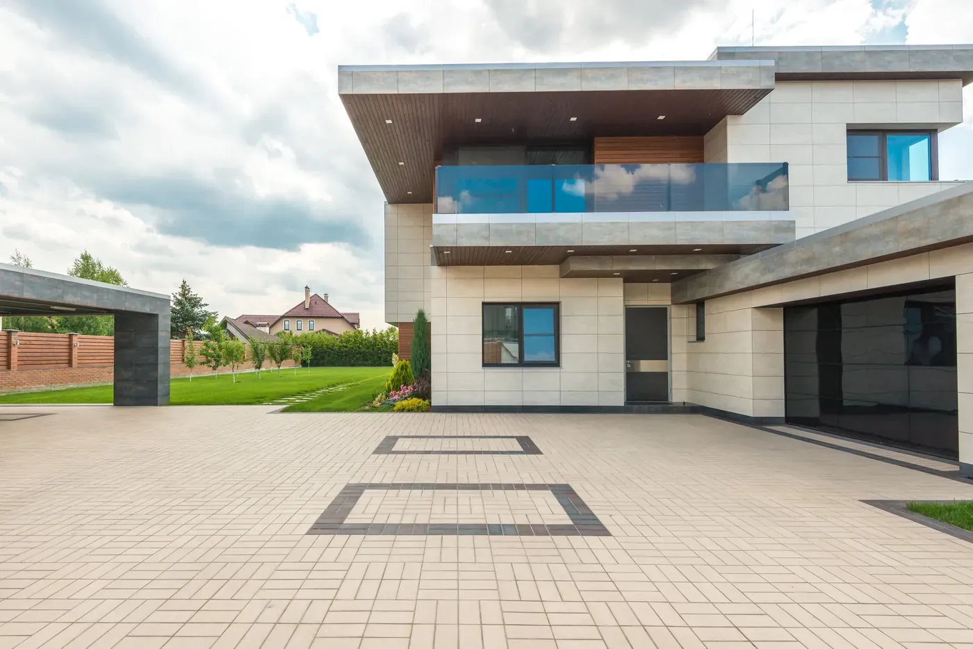 Exterior of a modern two-storey home with a paved driveway